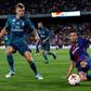 Real Madrid's Toni Kroos (L) fights for the ball with Barcelona's Sergio Busquets during the first leg of their Spanish Super Cup match, at Camp Nou in Barcelona, on August 13, 2017