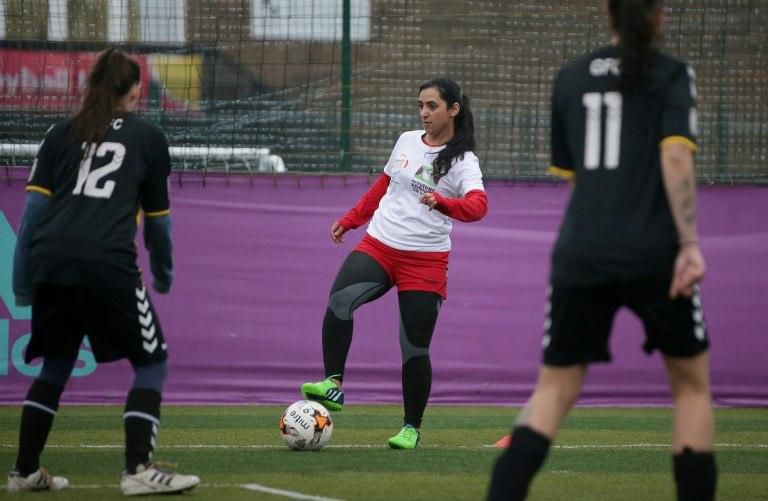 Former Afghanistan women's captain Khalida Popal (C, pictured at a training session in London) was quoted as saying male officials were 'coercing' female players