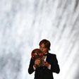 Real Madrid and Croatia midfielder Luka Modric kisses the trophy after receiving the 2018 Ballon d'Or