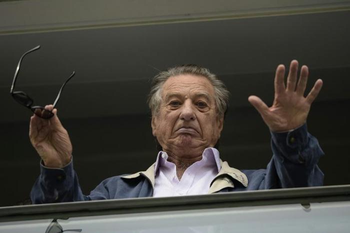 A file picture of Franco Macri, father of Argentina's President Mauricio Macri, waving from a box at the Bombonera football stadium during a football match in Buenos Aires on April 24, 2016