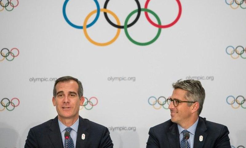 Los Angeles mayor Eric Garcetti (left) and LA 2028 chaiman Casey Wasserman (R) speak to the press in Lausanne, Switzerland, in July 2017