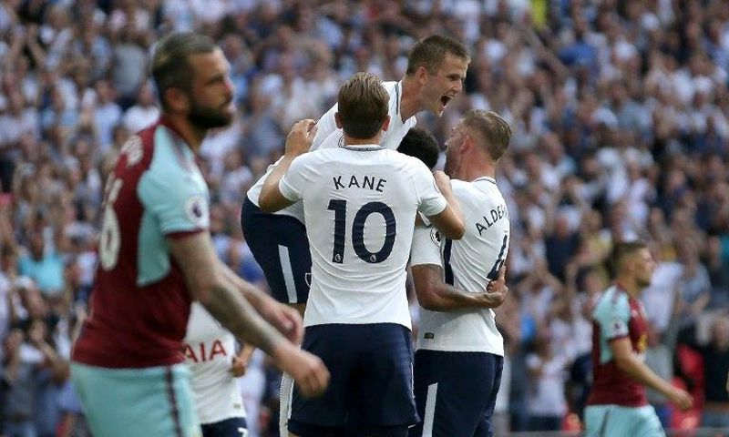 Tottenham Hotspur's Dele Alli celebrates with teammates after scoring a goal during their English Premier League match against Burnley, at Wembley Stadium in London, on August 27, 2017