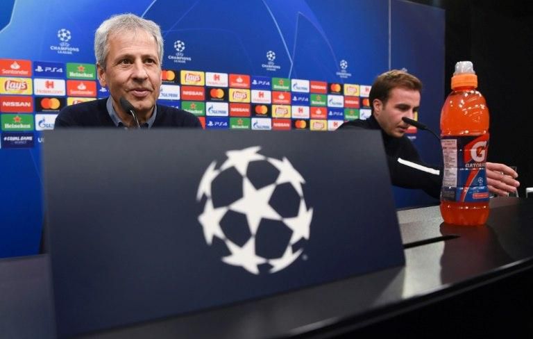 Borussia Dortmund's Germany forward Mario Goetze (R) and Swiss head coach Lucien Favre (L) expect a tough home match against Brugge on Wednesday with the hosts needing a point to reach the last 16 of the Champions League.