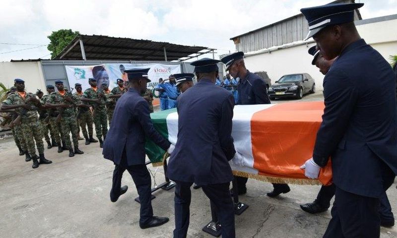 Pallbearers carry the coffin of football star Cheick Tiote during a funeral ceremony on June 18, 2017 in Abidjan