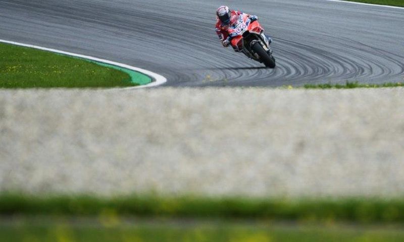 Ducati Team's Italian rider Andrea Dovizioso competes during the first practice session of the MotoGP Austrian Grand Prix weekend at the Red Bull Ring recing circuit in Spielberg, Austria, on August 11, 2017