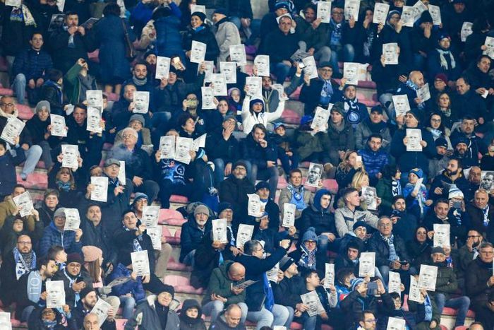 Napoli fans hold portraits of Napoli's Senegalese defender Kalidou Koulibaly who was the victim of racist abuse.