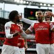 Arsenal players celebrate a goal against Tottenham on December 2, 2018