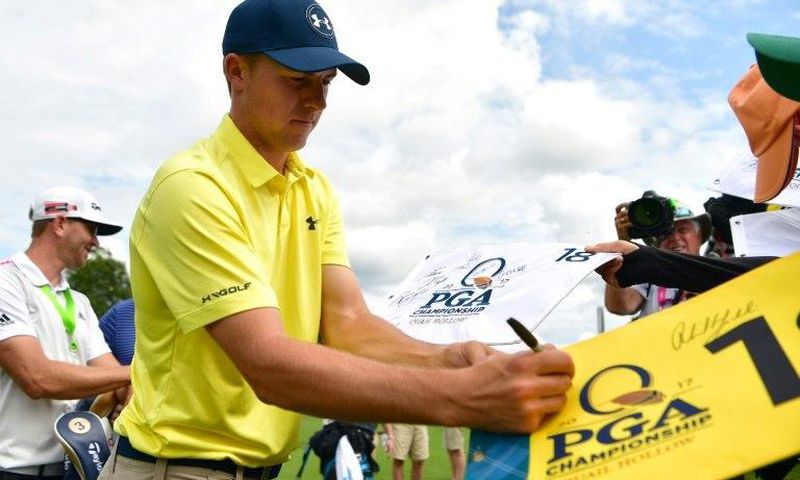 Jordan Spieth of the US signs autographs for fans during a practice round prior to the 2017 PGA Championship, at Quail Hollow Club in Charlotte, North Carolina, on August 8