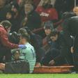 Arsenal defender Rob Holding receives medical attention at Old Trafford