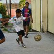 Cuban children play soccer in a street in Havana, where the "beautiful game" is threatening to topple baseball as the island's most popular sport