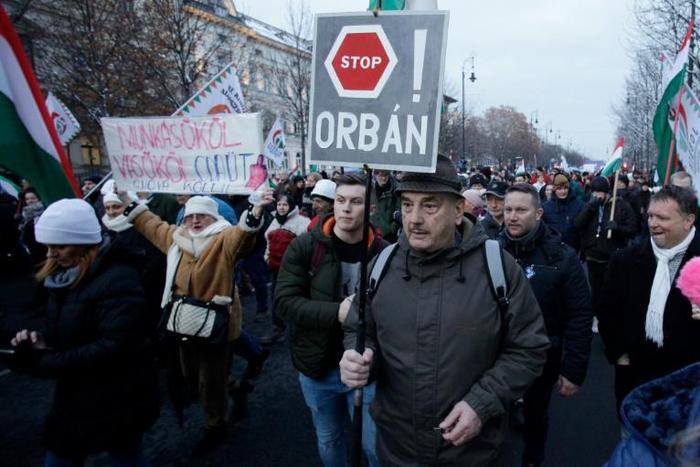 A protester shows his opposition to Prime Minister Viktor Orban's controversial labour reforms during a march in Budapest -- but Orban dismissed the rally as "hysterical shouting"