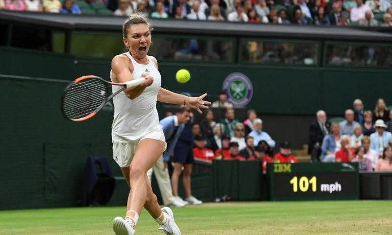 Romania's Simona Halep returns against Britain's Johanna Konta during their women's singles quarter-final match on the eighth day of the 2017 Wimbledon Championships on July 11, 2017
