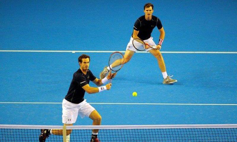 Britain's Andy Murray and Jamie Murray return to Argentina's Juan Martín del Potro and Leonardo Mayer during the Davis Cup semi-final match at the Emirates Arena in Glasgow, Scotland on September 17, 2016