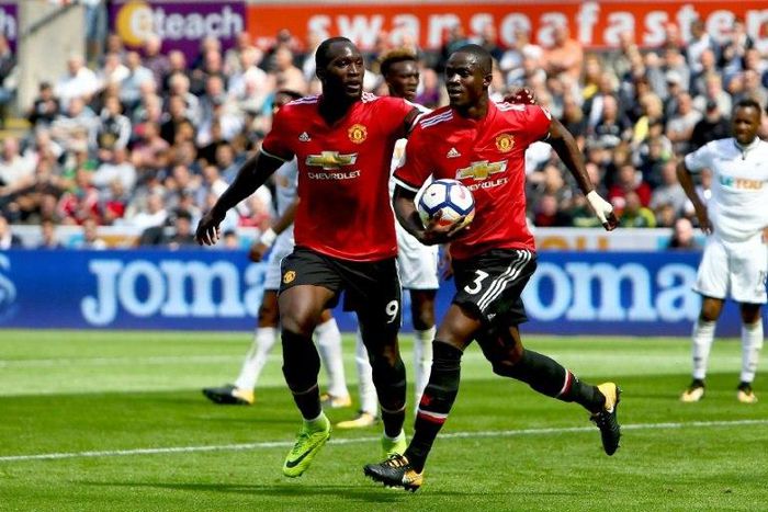 Manchester United's Eric Bailly (R) celebrates with teammate Romelu Lukaku after scoring a goal during their English Premier League match against Swansea City, at The Liberty Stadium in Swansea, south Wales, on August 19, 2017