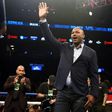 Former heavyweight champion Lennox Lewis (C) waves from the ring at Barclay's Center in Brooklyn, New York, in January 2016