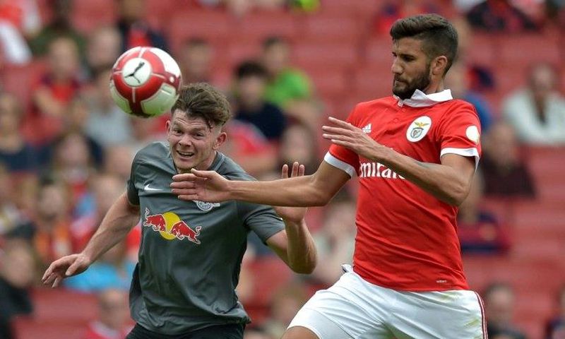 Leipzig's Scottish midfielder Oliver Burke (left) vies with Benfica's Argentinian defender Lisandro Lopez during their pre-season friendly match at The Emirates Stadium in north London on July 30, 2017