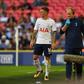 Tottenham Hotspur's defender Kieran Trippier (L) leaves the pitch after picking up an injury during a pre-season friendly football match against Juventus at Wembley stadium in London on August 5, 2017