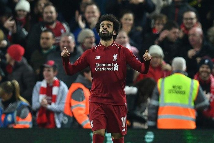 Mohamed Salah celebrates the goal that sent Liverpool into the Champions League last 16