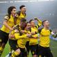 Thomas Delaney (bottom centre) is mobbed by his Dortmund team-mates after scoring against Schalke