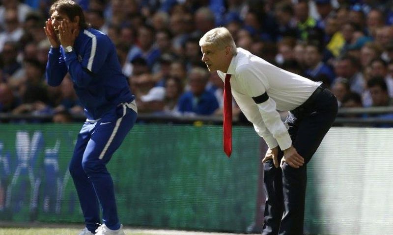 Chelsea's head coach Antonio Conte (L) and Arsenal's manager Arsene Wenger stand along the touchline during the English FA Community Shield football match on August 6, 2017