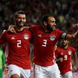 Egypt defenders Baher El-Mohamady (L) celebrates with his Ahmed Elmohamady (C) and Ahmed Hegazi (R) after scoring a goal during the Africa Cup of Nations qualifier football match against Tunisia near Alexandria November 16, 2018