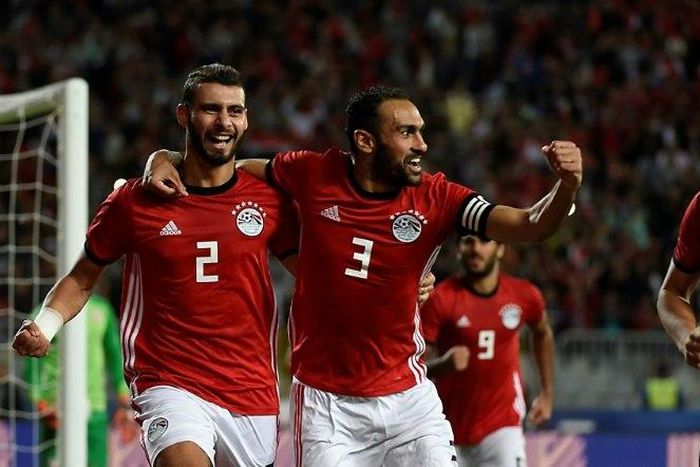 Egypt defenders Baher El-Mohamady (L) celebrates with his Ahmed Elmohamady (C) and Ahmed Hegazi (R) after scoring a goal during the Africa Cup of Nations qualifier football match against Tunisia near Alexandria November 16, 2018