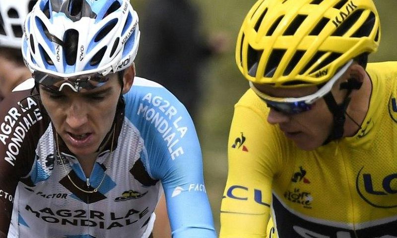 Britain's Chris Froome (R), wearing the overall leader's yellow jersey, speaks to France's Romain Bardet during the 17th stage of the Tour de France between Le La Mure and Serre-Chevalier in the French Alps on July 19, 2017