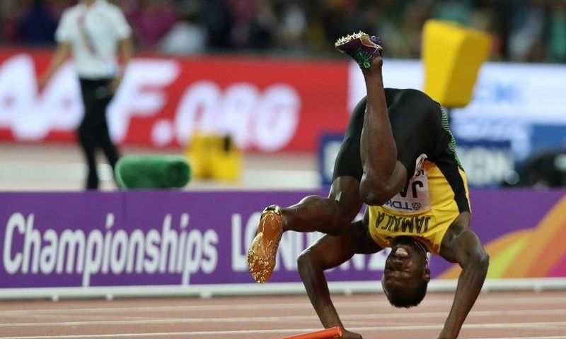 Jamaica's Usain Bolt falls after injuring himself in the final of the men's 4x100m relay at the 2017 IAAF World Championships at the London Stadium in London on August 12, 2017