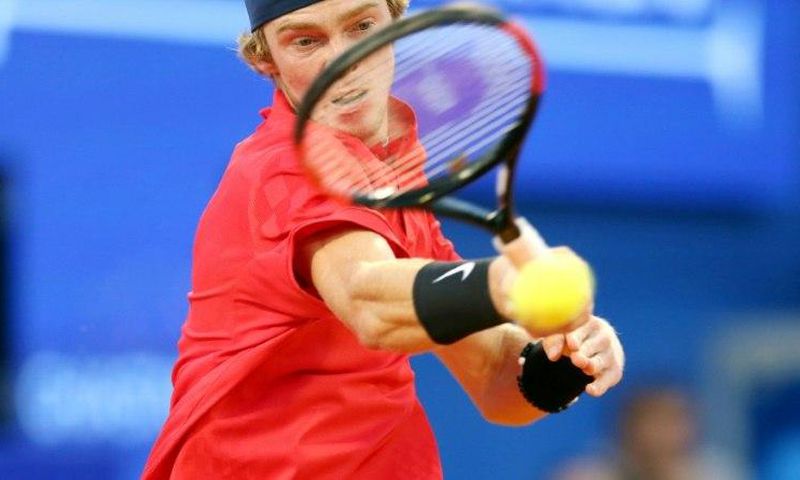Russia's Andrey Rublev returns the ball on July 23, 2017