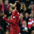 Eyeing history: Mohamed Salah celebrates as Liverpool beat Newcastle 4-0 to open up a six-point Premier League lead