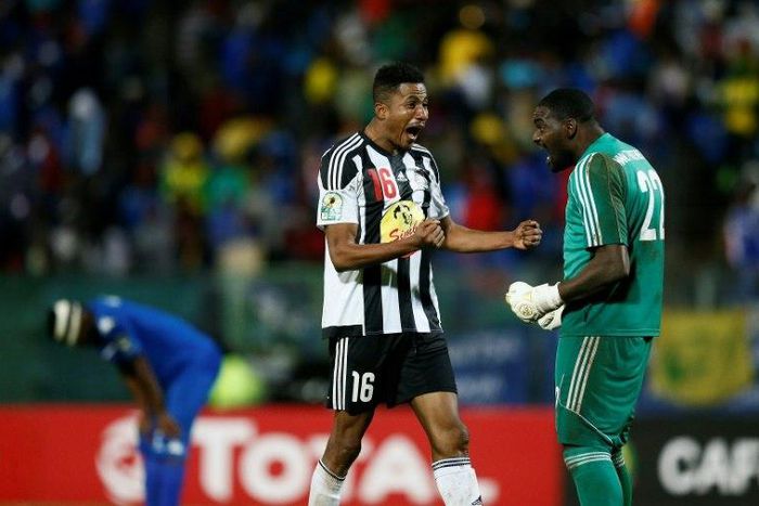 TP Mazembe duo Koffi Kouame (L) and Sylvain Gbohouo celebrate winning the 2017 CAF Confederation Cup