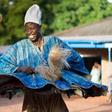 Man dancing happily in smock