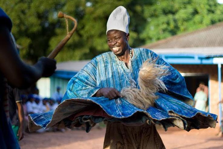Man dancing happily in smock