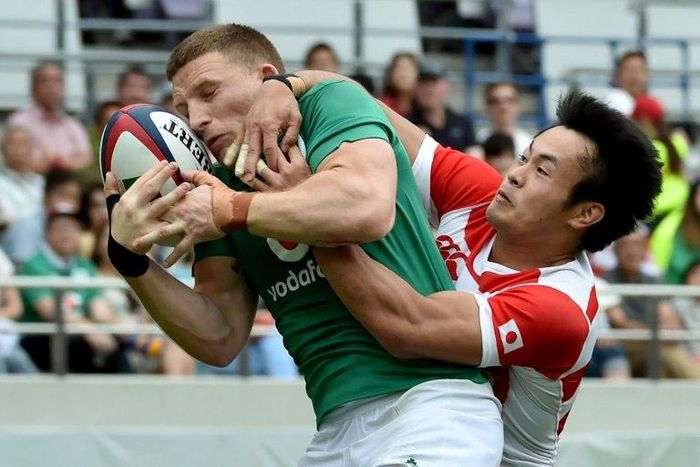 Japan left-wing Kenki Fukuoka (R) tackles Ireland fullback Andrew Conway during the second Test in Tokyo on June 24, 2017
