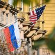 A Russian flag flies next to the US embassy building in Moscow