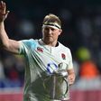 England's hooker and captain Dylan Hartley holds the Calcutta Cup trophy as leaves the pitch atfter winning the Six Nations international rugby union match between England and Scotland at Twickenham stadium in south west London on March 11, 2017