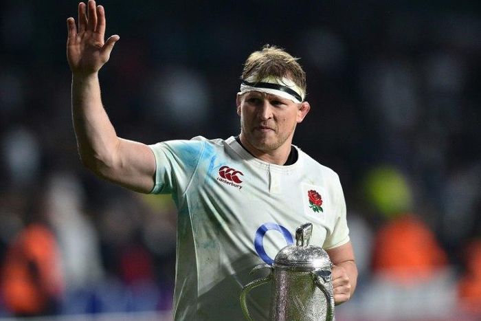 England's hooker and captain Dylan Hartley holds the Calcutta Cup trophy as leaves the pitch atfter winning the Six Nations international rugby union match between England and Scotland at Twickenham stadium in south west London on March 11, 2017