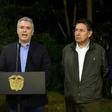 Colombian President Ivan Duque (C) speaks next to Colombian Defense Minister Guillermo Botero (L) and Colombian Attorney General Nestor Humberto Martinez (R) at the Narino presidential palace in Bogota on December 21, 2018