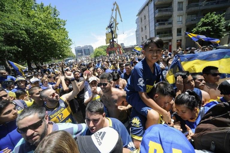 Boca fans await their team outside their hotel before the Copa Libertadores final was postponed