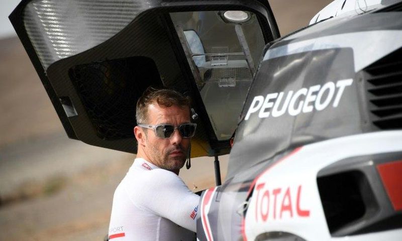 Peugeot's French driver Sebastien Loeb gets ready for a start of the Silk Way 2017 between Urumqi and Hami China, on July 17, 2017