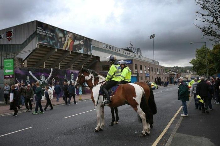 Police and fans outside Burnley's Turf Moor stadium
