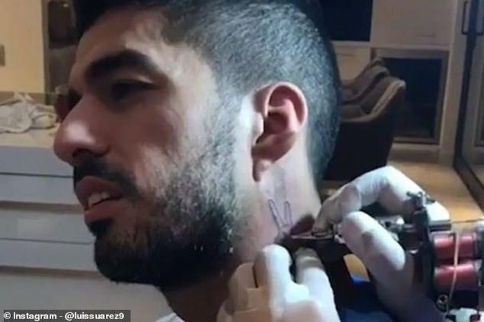 ___9180901___2018___12___8___18___7155250-6473333-Barcelona_star_Luis_Suarez_has_got_his_trademark_celebration_tat-a-35_1544225644672