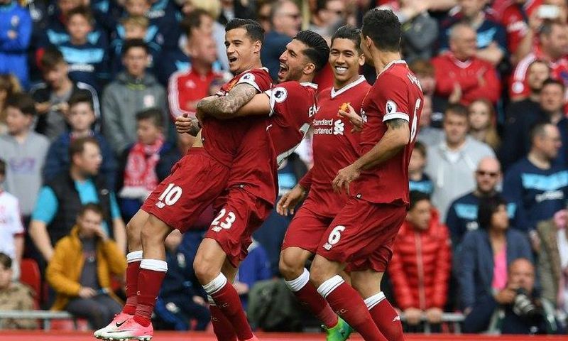 Liverpool's Philippe Coutinho (L) celebrates with teammates after scoring a goal during an English Premier League match, at Anfield in Liverpool, in May 2017