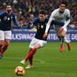 France defender Benjamin Pavard (C) vies with Uruguay forward Edinson Cavani during a November 20 friendly at the Stade de France.