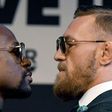 Boxer Floyd Mayweather Jr. (L) and UFC lightweight champion Conor McGregor face off during a news conference at the KA Theatre at MGM Grand Hotel & Casino on August 23, 2017 in Las Vegas, Nevada
