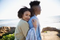 Black couple hug [Credit - iStock]