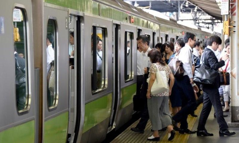 The scene at a Tokyo train station as Japan launches an exercise to encourage commuters to work from home in the run-up to the summer Olympics in 2020