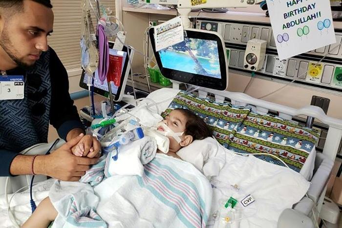 Shaima Swileh, a native of Yemen, was granted a US visa to visit her dying two-year-old son Abdullah Hassan, a US citizen like his father Ali -- both of whom are pictured here at UCSF Benioff Children's Hospital in Oakland on December 16, 2018