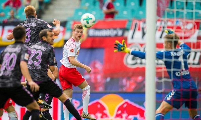 Leipzig's Timo Werner (C) scores the first goal for his team during their match against SC Freiburg in Leipzig, eastern Germany on August 27