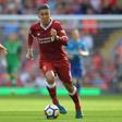 Liverpool's Roberto Firmino runs with the ball during their match against Arsenal in Liverpool, north west England on August 27